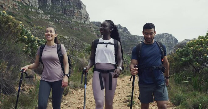 Trekking, nature exploration and happy people walk on outdoor morning journey, backpacking tour or cardio exercise. Wellness, conversation and hiking friends talk about workout, training or fitness