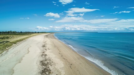 Beautiful sea view with waves, clear blue sky and beach sand