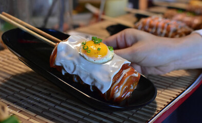 Take a close-up shot of cooking and food handling.