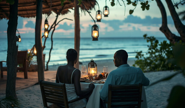 Black African couple on the beach, on vacation holiday, dining on the beach sand, in a intimate romantic date night valentines moment, bespoke rustic restaurant with hanging lights in the evening