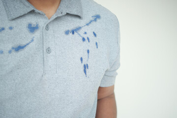  shirt with blue ink stain .