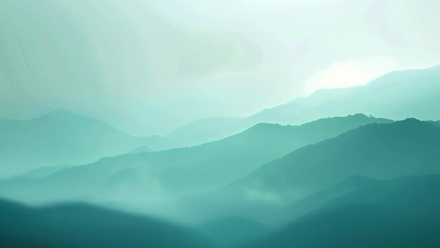 A blurred mountain vista in shades of blue and green giving a tranquil and serene feel to the overall image. .