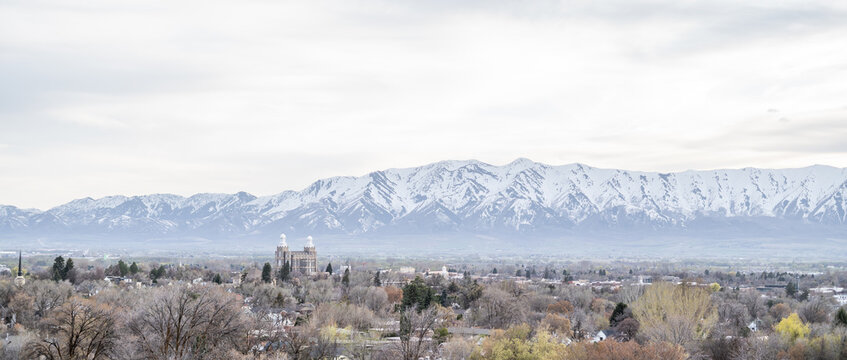 Tops of Logan City Utah White Capped Mountains