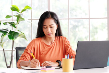 Work from home, Asian woman working with laptop computer at home, Asia female shopping online, Happy girl learning by internet, study online education, e commerce business