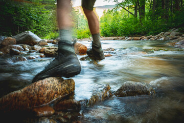 Hiker Crossing Stream in the White Mountains