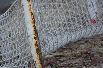 Macro of rusty broken soccer net