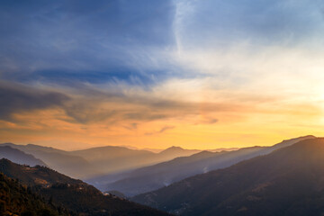 Sunset over the mountains. Majestic panoramic view of the Himalayan range in the Kumaun region of...