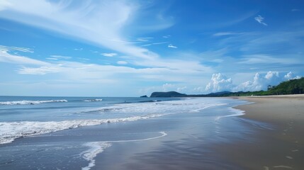 Beautiful sea view with waves, clear blue sky and beach sand