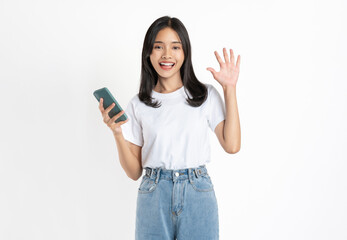 Smiling student girl in university uniform holding smartphone and looking on white background.