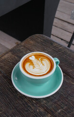 cup of coffee on wooden table