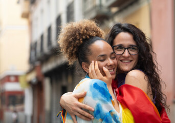 two loving lesbian women walking down the street in Madrid city with copy space