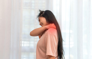 Woman unhappy holding neck pain with suffering from painful shoulder, Upper arm pain, office...