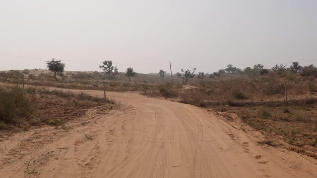 san dunes safari and offloading by motorcar at deserts at day from different angle video is taken at rajasthan, India.