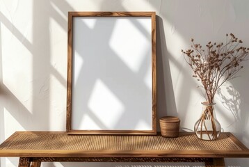 Wooden Picture Frame on Wooden Table With Dry Flowers in Vase During Afternoon - 793599726