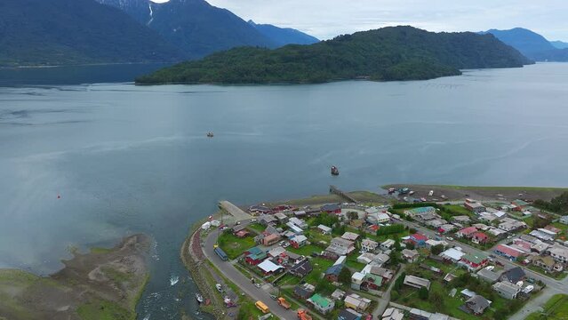 Aerial Flying Over Hualaihué, A Chilean commune located in Palena Province, Los Lagos Region Beside Fjord Waterway. Orbit Motion Shot