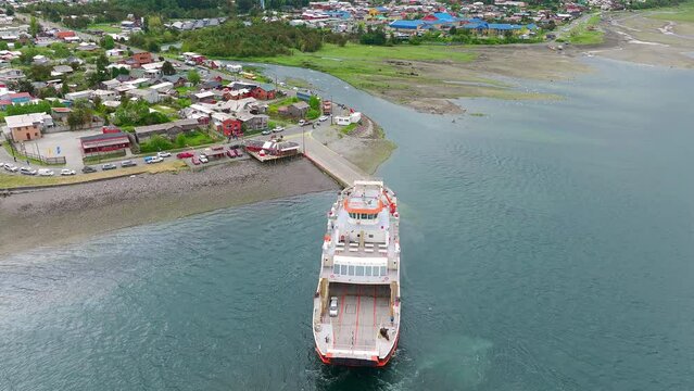 Ferry Boat Docked At Ramp In Hornopiren Town Located In Commune Of Hualaihué in Palena Province, Southern Chile. Aerial Circle Dolly Shot