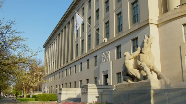 The Federal Trade Commission building in spring with Man Controlling Trade statue