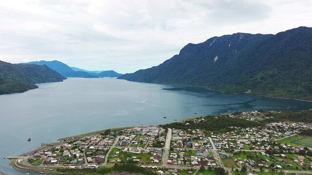 Aerial View Hualaihué, A Chilean commune located in Palena Province, Los Lagos Region Beside Fjord Waterway. Pull Back Shot