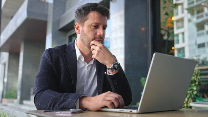 Handsome 30s top manager work laptop. Entrepreneur type computer macbook. Business man look...