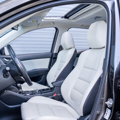 Leather interior design, car passenger and driver seats, clean, wide angle view, white perforated...