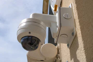 Foto op Canvas CCTV Security camera round 360 for protect building security camera in city street © OceanProd