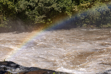 rainbow on a river in the afternoon