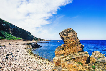 Rocks by the seashore a beautiful sunny summer day - 793611996