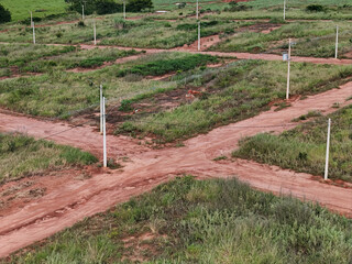 ew subdivision for houses, dirt road and power poles