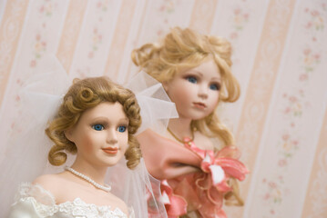 Doll collection in a bedroom