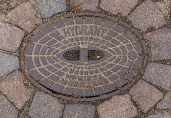 manhole cover on the pavement