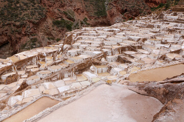 Salt evaporation ponds in Maras salt mines in Cusco city the Sacred Valley, Peru