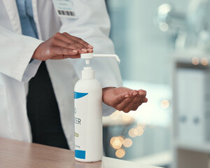 Healthcare, doctor and hand sanitizer for virus safety, protection and prevention in hospital....