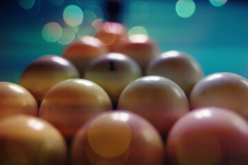 Billiard balls and cue on pool table. Russian billiards. Close-up of items for the game. Background space. Concept of sports games. Place for an inscription or logo. Copy space for site or banner