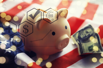 Piggy bank on USA flag close-up. Saving money in United States concept.
