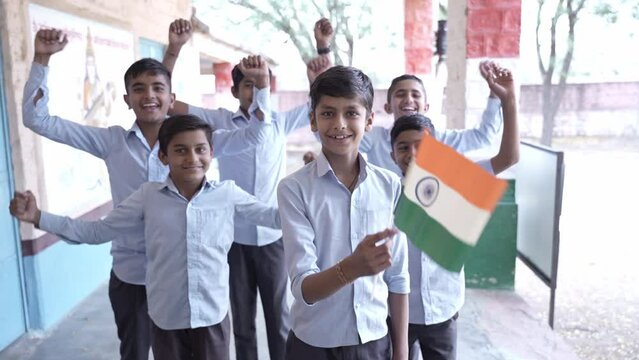 Group of proud schoolboys students hold indian flag celebrating Independence day, Republic day, patriotism, education, people of india. Cricket fan cheering for team.