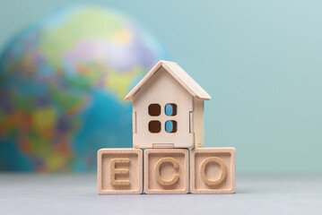 Eco-Friendly Housing Concept with Wooden Blocks and House Model