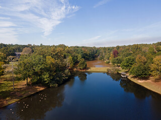 Aerial sunset landscape of forest and lake in rural neighborhood CSRA Grovetown Augusta Georgia