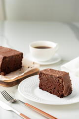 Fresh homemade chocolate sponge cake on wooden board