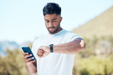 Man, fitness and checking time with watch in nature for tracking performance, steps or workout...