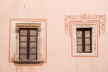 Fototapeta na wymiar Two asymmetric windows on a facade of a building in Moia, Catalonia (SPAIN)