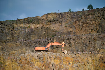 Large excavator in a stone quarry. Industrial mining landscape