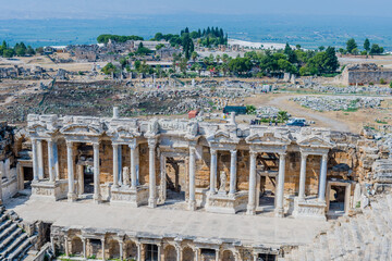 A well-preserved ancient theater with rows of columns at ancient site of Hierapolis in Pamukkale,...