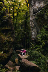couple tourists hiking at canyon in the forest