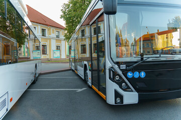 A new modern bus. Modern public electric transport. Details of the bus in close-up, headlights, windshield, driver's cabin.