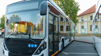 A new modern bus. Modern public electric transport. Details of the bus in close-up, headlights,...