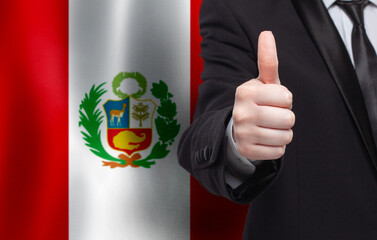 Peru concept. Businessman showing thumb up on the background of flag of Peru - 793648523