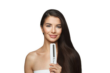 Happy young healthy brunette woman holding hair iron and straightening her long smooth shiny hair isolated on white background. Haircare, hairstyle, hairdressing and hair styling concept