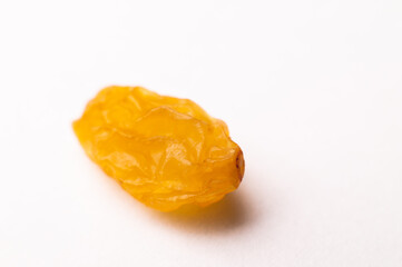 macro photography of raisins on a white background, side view. close-up of one piece of raisin