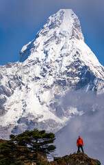 Person in front of huge wall of Ama Dablam mountain in Khumbu, Nepal