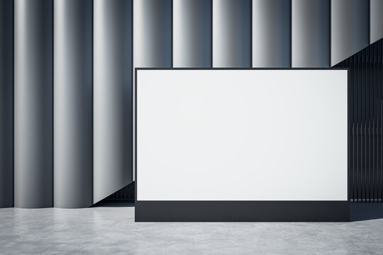 Modern designer wall with empty white mock up billboard in empty underground interior. 3D Rendering.